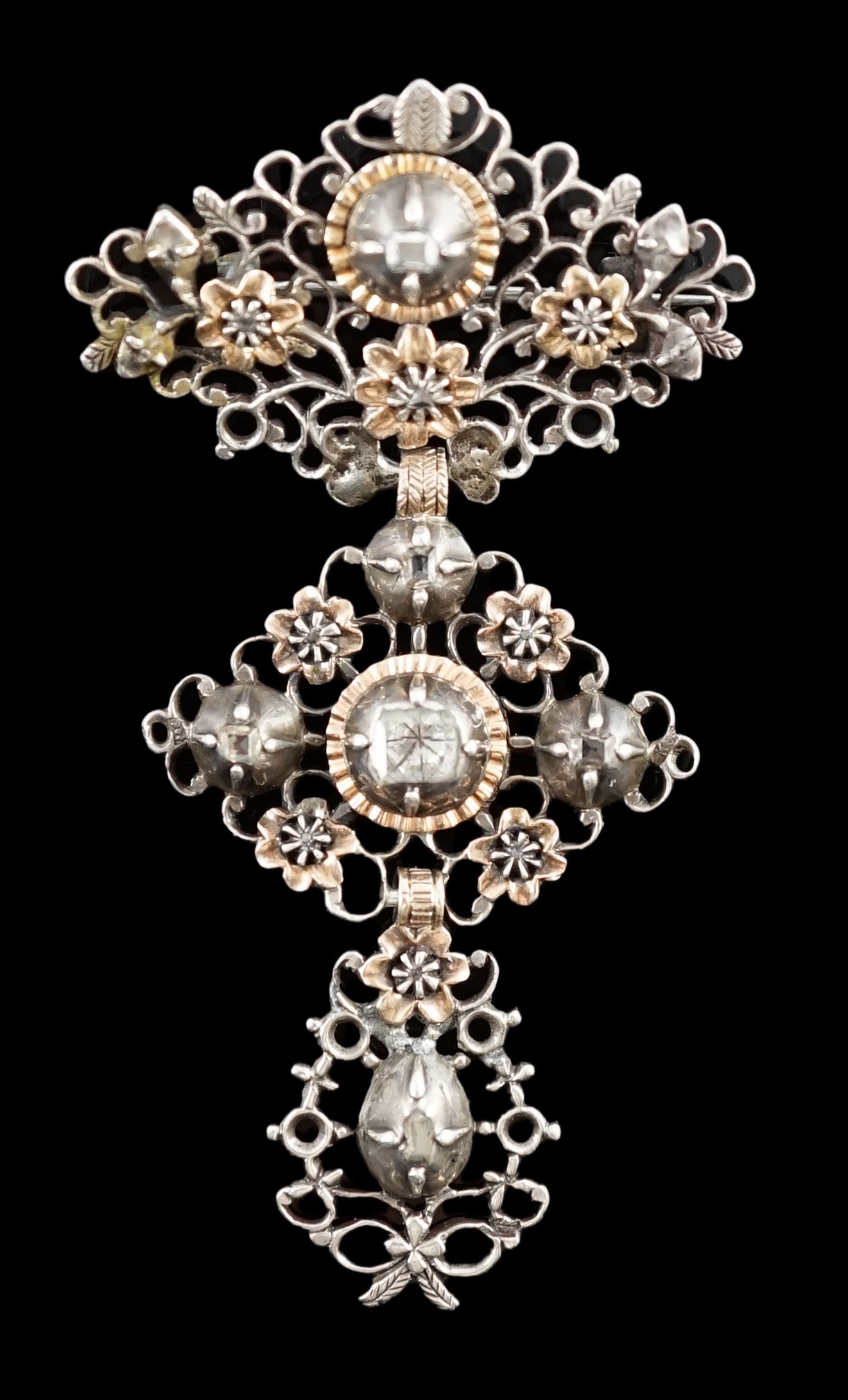 An antique pierced gold, silver and diamond set drop brooch